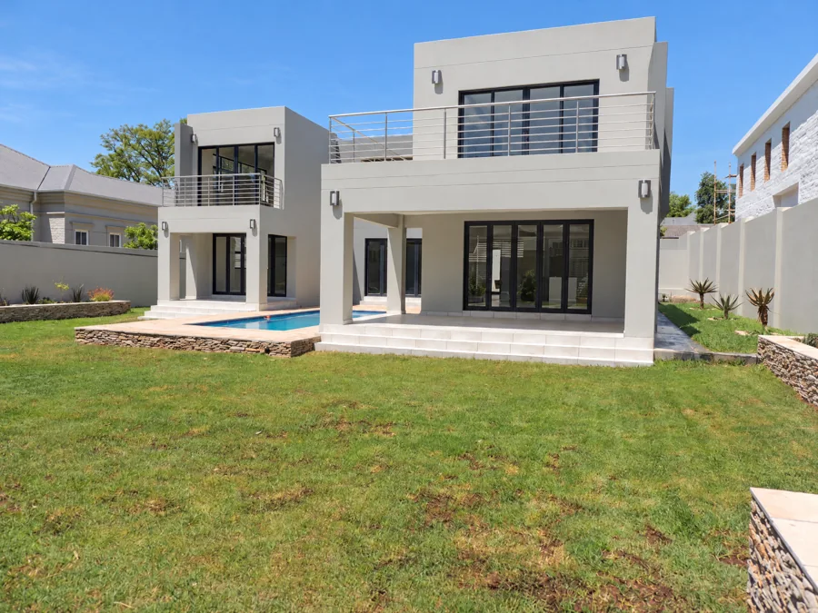 Bryanston — Angled rear garden view with pool